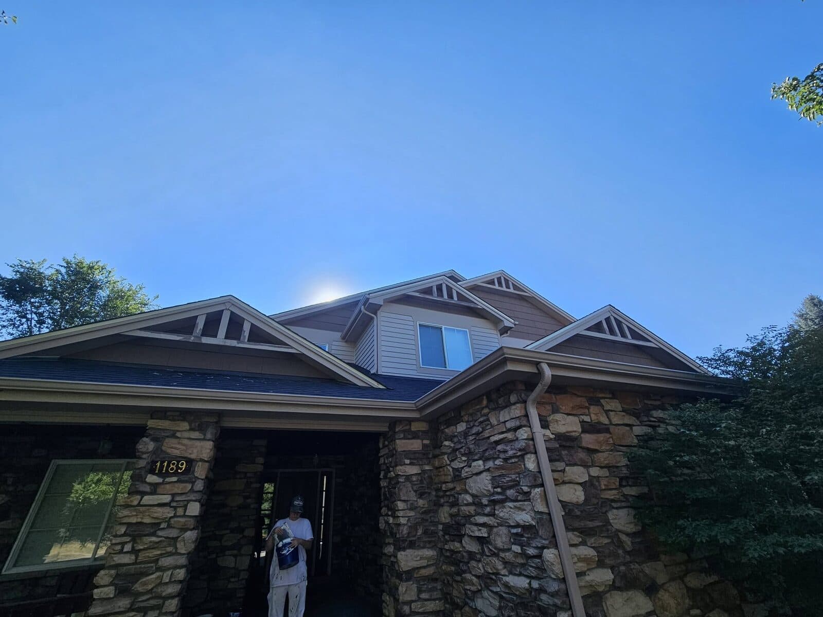 Freshly finished soffits and trim on a stone home