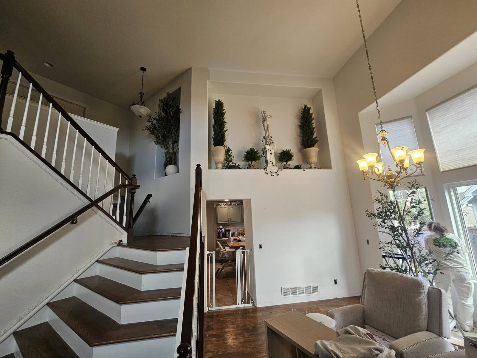 Bright white two-story foyer and staircase